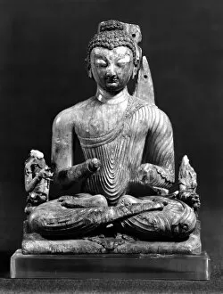 Carved ivory seated Buddha from India, 8th century