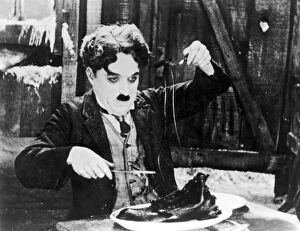 Rush Gallery: CHAPLIN: THE GOLD RUSH. Charlie Chaplin in a scene from The Gold Rush, 1925
