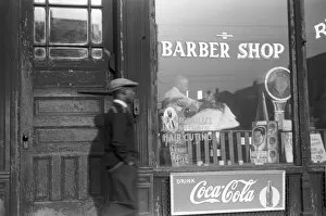 CHICAGO: BARBER SHOP, 1941. A barbershop in the Black Belt section of Chicago, Illinois