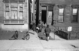 CHICAGO: CHILDREN, 1941. Children playing outside of an apartment building on the