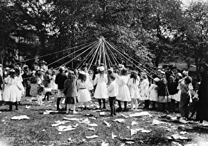 Children dancing around a Maypole in Central Park, New York City. Photograph, 1905 Children dancing around a Maypole in Central Park, New York City. Photograph, 1905