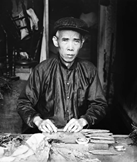 CIGAR MAKER, 1920. Portrait of Lee Ying, a Chinese cigar maker in his shop in Washington D CIGAR MAKER, 1920. Portrait of Lee Ying, a Chinese cigar maker in his shop in Washington D
