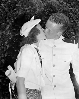 CONGRATULATIONS KISS, 1939. Walter B. Miller receiving a kiss from his girlfriend CONGRATULATIONS KISS, 1939. Walter B. Miller receiving a kiss from his girlfriend