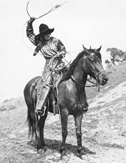 COWGIRL, c1920. Josie Sedgwick showing the use of a lariat. Photograph, c1920 COWGIRL, c1920. Josie Sedgwick showing the use of a lariat. Photograph, c1920