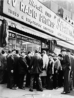 A crowd gathered around a radio shop at Greenwich and Dey Streets in New York City A crowd gathered around a radio shop at Greenwich and Dey Streets in New York City