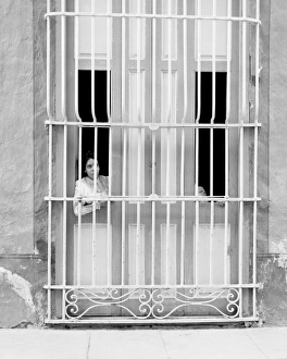 CUBA: HAVANA, c1903. A woman leans out of a window in Havana, Cuba. Photograph, c1903 CUBA: HAVANA, c1903. A woman leans out of a window in Havana, Cuba. Photograph, c1903