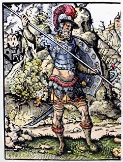DAVID AND GOLIATH. Goliath, the Philistine warrior, prepares to do battle against David DAVID AND GOLIATH. Goliath, the Philistine warrior, prepares to do battle against David