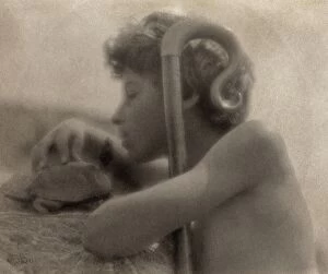 DAY: BOY, 1905. Portrait of a boy with a shepherds crook and tortoise. Photograph by F