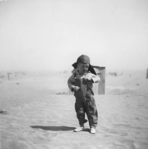 DUST BOWL, 1936. Farm boy in the dust bowl area of Cimarron County, Oklahoma DUST BOWL, 1936. Farm boy in the dust bowl area of Cimarron County, Oklahoma