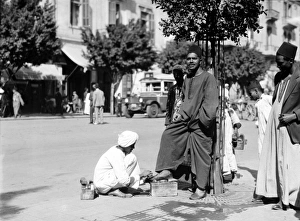 EGYPT: CAIRO. Shoe shiner on the streets of Cairo, Egypt EGYPT: CAIRO. Shoe shiner on the streets of Cairo, Egypt