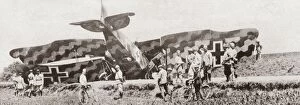 An elaborately camouflaged German fighter plane brought down by a French Canon de 75 anti-aircraft gun during World War