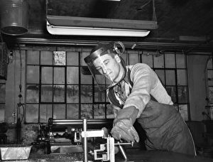 FACTORY WORKER, 1942. John Scott, a sheet metal cutter at work at the Warren McArthur FACTORY WORKER, 1942. John Scott, a sheet metal cutter at work at the Warren McArthur