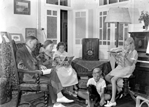 FAMILY, 1930s. A family in Jerusalem seated around a radio, reading. Photographed between 1937 FAMILY, 1930s. A family in Jerusalem seated around a radio, reading. Photographed between 1937