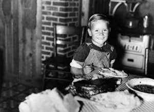 FARM BOY, 1940. Child of a former sharecropper eating at a table in southeast Missouri FARM BOY, 1940. Child of a former sharecropper eating at a table in southeast Missouri