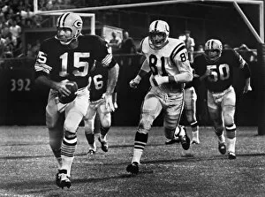 County Gallery: FOOTBALL GAME, 1966. Quarterback Bart Starr of the Green Bay Packers attempting to run for a first