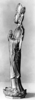 Gilt bronze figure of the bodhisattva Guanyin standing on a lotus pedestal. Height: 13 1/2 in Gilt bronze figure of the bodhisattva Guanyin standing on a lotus pedestal. Height: 13 1/2 in
