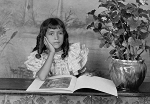 GIRL READING, c1899. Photograph by Thomas E. Askew of his daughter with a book, c1899 GIRL READING, c1899. Photograph by Thomas E. Askew of his daughter with a book, c1899