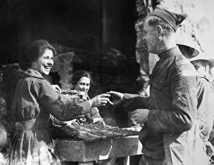 Gladys McIntyre giving doughnuts to an American infantryman of the 26th Division at Gladys McIntyre giving doughnuts to an American infantryman of the 26th Division at