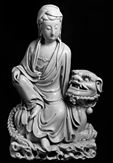 Glazed porcelain figure of the bodhisattva Guanyin seated on a lion Glazed porcelain figure of the bodhisattva Guanyin seated on a lion