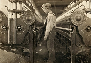 HINE: CHILD LABOR, 1908. A young doffer at Rhodes Mfg. Company in Lincolnton HINE: CHILD LABOR, 1908. A young doffer at Rhodes Mfg. Company in Lincolnton