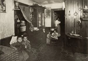Architecture Collection: HINE: MILL HOUSING, 1912. An Italian American mother and five children in their