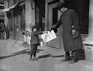 HINE: NEWSBOY, 1917. Seven-year-old newsboy, John Dowers, at work in Oklahoma City HINE: NEWSBOY, 1917. Seven-year-old newsboy, John Dowers, at work in Oklahoma City