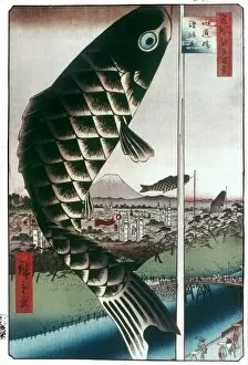 HIROSHIGE: KITES, 1857. Carp kites flown from masts. Color woodblock print from One Hundred Famous Views of Edo