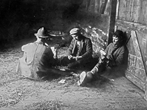 HOBOS, c1915. A group of hobos playing cards in a boxcar. Photograph, c1915 HOBOS, c1915. A group of hobos playing cards in a boxcar. Photograph, c1915