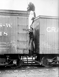 HOBOS, c1915. Hoboes fighting between railroad cars. Photograph, c1915 HOBOS, c1915. Hoboes fighting between railroad cars. Photograph, c1915
