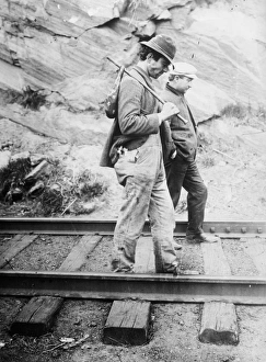 HOBOS, c1920. Hobos walking along the railroad tracks, after being kicked off the train HOBOS, c1920. Hobos walking along the railroad tracks, after being kicked off the train