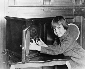 JACKIE COOGAN (1914-1984). American actor. Coogan tuning an RCA Radiola IV radio, c1923 JACKIE COOGAN (1914-1984). American actor. Coogan tuning an RCA Radiola IV radio, c1923