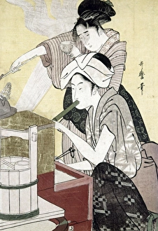 JAPAN: KITCHEN, c1775. Woman blowing on a kitchen fire. Woodblock print, late 18th century JAPAN: KITCHEN, c1775. Woman blowing on a kitchen fire. Woodblock print, late 18th century