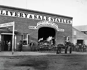 John C. Howards livery stable and saloon on G Street in Washington, D.C., where John H John C. Howards livery stable and saloon on G Street in Washington, D.C., where John H