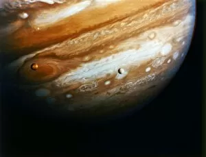 JUPITER. View of Jupiter and its moons Europa and Io from 12 million miles