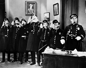 KEYSTONE COPS. Scene from one of the Keystone Kobs comedies produced by Mack Sennett KEYSTONE COPS. Scene from one of the Keystone Kobs comedies produced by Mack Sennett