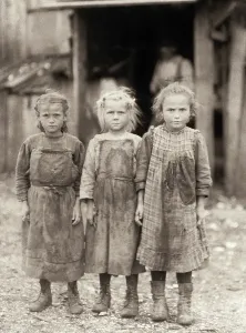 Prints of HINE: CHILD LABOR, 1911. Three young oyster shuckers at the Maggioni Canning Co. in Port Royal, South Carolina. Photograph by Lewis Hine, February 1911 H Prints: Hine's Print of Young Oyster Shuckers, 1911