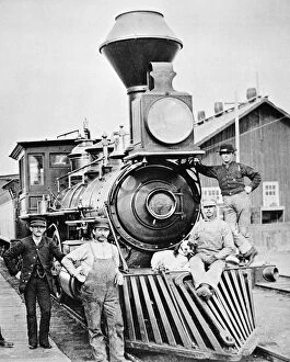 Mascot Gallery: LOCOMOTIVE, 1883. The conductor, crew and canine mascot of a Central Pacific Railroad train posing