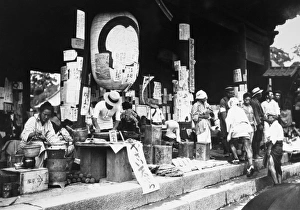 A makeshift food market at the gate of a Buddhist temple in or near Tokyo, Japan A makeshift food market at the gate of a Buddhist temple in or near Tokyo, Japan