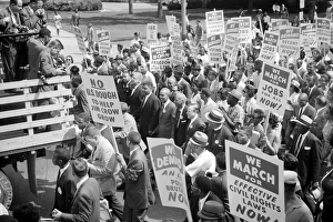 Martin Luther King, Jr., Roy Wilkins, and other civil rights leaders surrounded by crowds Martin Luther King, Jr., Roy Wilkins, and other civil rights leaders surrounded by crowds