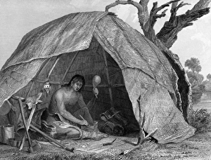 A medicine man concocting a pot of medicine to the accompaniment of the sacred rattle A medicine man concocting a pot of medicine to the accompaniment of the sacred rattle