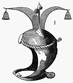 MEDIEVAL PUNISHMENT. Helmet with a jesters cap and bells, used as a means of degredation MEDIEVAL PUNISHMENT. Helmet with a jesters cap and bells, used as a means of degredation