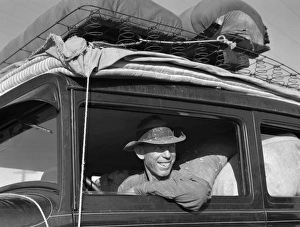 MIGRANT WORKER, 1939. Migrant cotton picker, photographed along Highway 99 between Tulare MIGRANT WORKER, 1939. Migrant cotton picker, photographed along Highway 99 between Tulare