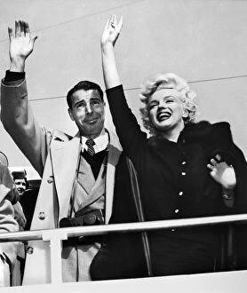 Gesture Gallery: MONROE & DIMAGGIO, c1954. Marilyn Monroe and her husband Joe DiMaggio, waving to a crowd
