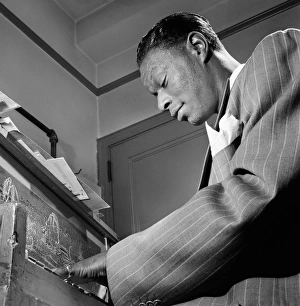 NAT KING COLE (1919-1965). American musician. Photograph by William P. Gottlieb, c1947 NAT KING COLE (1919-1965). American musician. Photograph by William P. Gottlieb, c1947