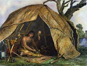 A Native American medicine man, or shaman, concocting a pot of medicine to A Native American medicine man, or shaman, concocting a pot of medicine to
