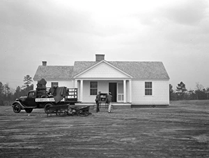 NEW HOME, 1937. The Dougherty family moving furniture into their new home in Gardendale NEW HOME, 1937. The Dougherty family moving furniture into their new home in Gardendale