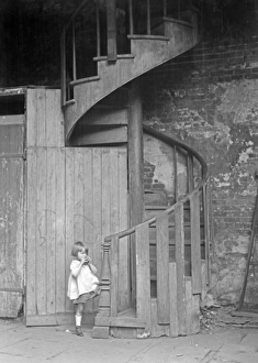 NEW ORLEANS, c1925. A spiral staircase in New Orleans, Louisiana NEW ORLEANS, c1925. A spiral staircase in New Orleans, Louisiana