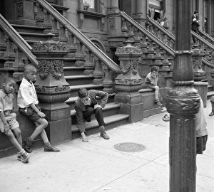 NEW YORK CITY, 1938. Boys playing on a stoop in Harlem, New York City NEW YORK CITY, 1938. Boys playing on a stoop in Harlem, New York City