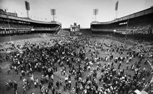 NEW YORK: POLO GROUNDS. Crowd of baseball fans pouring onto the field at the Polo Grounds in New York City after