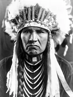 Nez Perce Gallery: NEZ PERCE NATIVE AMERICAN. A Nez Perce Native American wearing a feather headdress